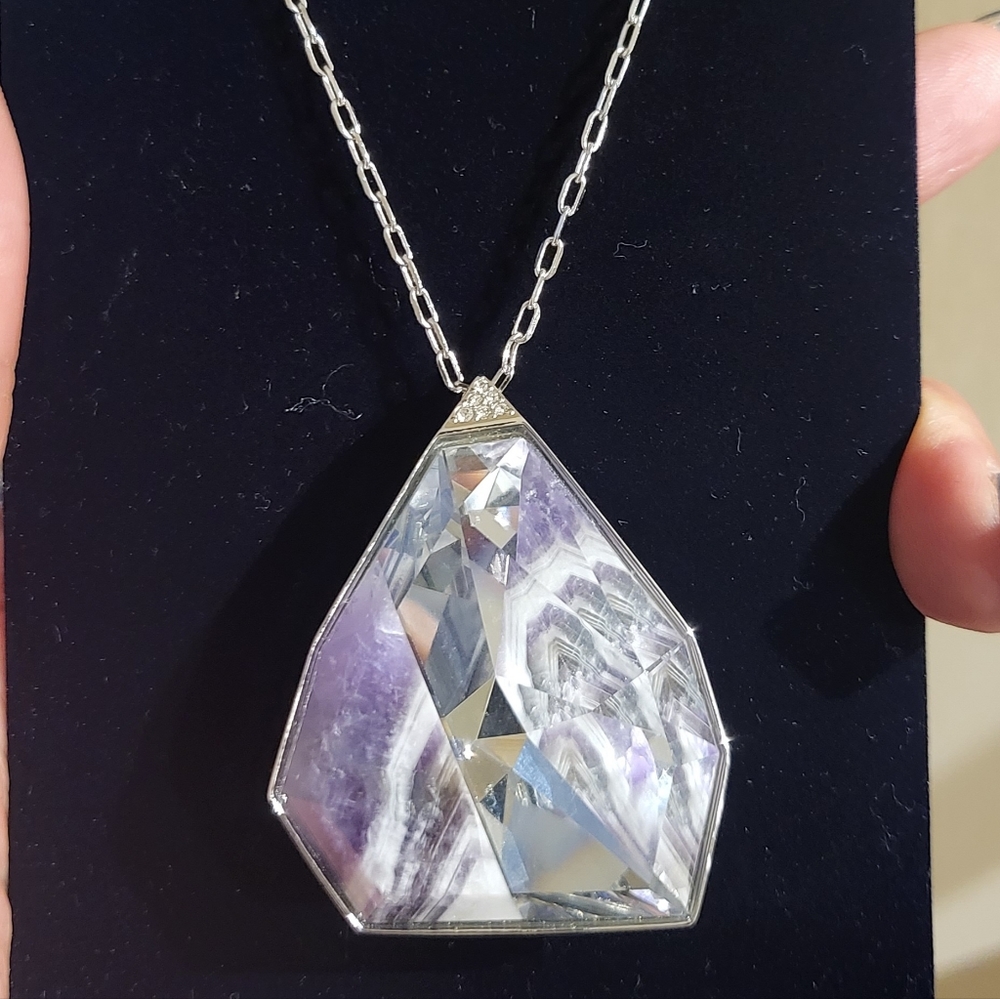 Swarovski crystal pendant...Chain is 22 inches long and can be adjusted.